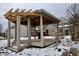 Wooden pergola structure in a snow-covered backyard at 868 N Raceway Rd, Indianapolis, IN 46234