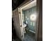 Small powder room with pedestal sink, decorative window, and beach-themed decor at 868 N Raceway Rd, Indianapolis, IN 46234