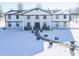 Two-story home, white and black exterior, snowy landscape, columned entryway, and spacious yard at 881 E 226Th St, Sheridan, IN 46069
