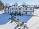 Aerial view of a two story home with a walkway leading to the entrance, in a snowy landscape at 881 E 226Th St, Sheridan, IN 46069