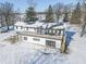 Spacious deck with a view, stairs leading to the yard, and snowy landscape at 881 E 226Th St, Sheridan, IN 46069