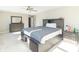 Spacious bedroom with king-size bed, dresser and ceiling fan at 881 E 226Th St, Sheridan, IN 46069