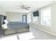 Bright bedroom with king-size bed, ceiling fan and large windows at 881 E 226Th St, Sheridan, IN 46069