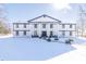 Two story home with white siding and black accents in winter setting at 881 E 226Th St, Sheridan, IN 46069