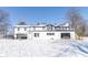 Two story home with white siding and black accents in winter setting at 881 E 226Th St, Sheridan, IN 46069