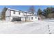Two story home with white siding and black accents in winter setting at 881 E 226Th St, Sheridan, IN 46069