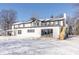 Two story home with white siding and black accents in winter setting at 881 E 226Th St, Sheridan, IN 46069