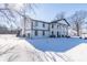 Two story home with white siding and black accents in winter setting at 881 E 226Th St, Sheridan, IN 46069
