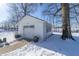 Detached white garage with black door, snow on ground at 881 E 226Th St, Sheridan, IN 46069