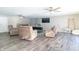 Gathering room with fireplace, comfortable seating, and wood-look flooring at 881 E 226Th St, Sheridan, IN 46069