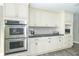 Kitchen with white cabinets, double oven, and granite countertops at 881 E 226Th St, Sheridan, IN 46069