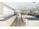 Modern kitchen with white cabinets, granite counters, and stainless steel appliances at 881 E 226Th St, Sheridan, IN 46069