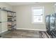 Laundry room with washer, dryer, and storage shelves at 881 E 226Th St, Sheridan, IN 46069