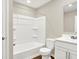 Clean bathroom featuring a tub-shower combo, white vanity, and wood-look flooring at 9711 Palermo Ave, Indianapolis, IN 46239