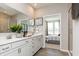 Elegant bathroom with double vanity, large mirror, and walk-in shower at 9711 Palermo Ave, Indianapolis, IN 46239