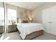 Charming bedroom with wood bed frame, and large window at 9711 Palermo Ave, Indianapolis, IN 46239