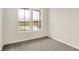 Bright bedroom with carpet, neutral walls, and large window at 9711 Palermo Ave, Indianapolis, IN 46239