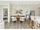 Casual breakfast nook with a round table and chairs, situated next to the kitchen at 9711 Palermo Ave, Indianapolis, IN 46239