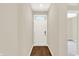 Bright entryway featuring a white front door with transom window and sleek wood-look flooring at 9711 Palermo Ave, Indianapolis, IN 46239