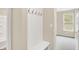Hallway with a coat rack and bench leading into a bedroom at 9711 Palermo Ave, Indianapolis, IN 46239