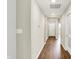 Open hallway with hardwood floors leading to the front door, offering a bright and welcoming entrance at 9711 Palermo Ave, Indianapolis, IN 46239