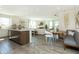 Open kitchen with island, breakfast nook, and a view into the adjacent living room at 9711 Palermo Ave, Indianapolis, IN 46239