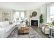 Relaxing living room featuring a fireplace, sectional sofa, and hardwood floors at 9711 Palermo Ave, Indianapolis, IN 46239