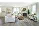 Bright living room with a sectional sofa, fireplace, and large windows offering natural light at 9711 Palermo Ave, Indianapolis, IN 46239