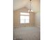 Spacious dining room with gray carpet, vaulted ceiling, and a chandelier at Lot 34 Doe Meadow Dr, Anderson, IN 46011