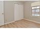 Bedroom with double-door closet and neutral walls and floors at 1061 Oak Leaf Rd, Franklin, IN 46131