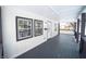 Newly renovated front porch with dark stained wood flooring at 1302 Ingomar St, Indianapolis, IN 46241