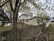 A large backyard with mature trees and a fence at 1498 South St, Noblesville, IN 46060