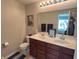 Double vanity bathroom with a toilet and large mirror at 15365 Mystic Rock Dr, Carmel, IN 46033