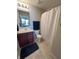 Clean bathroom with shower/tub combo and dark wood vanity at 15365 Mystic Rock Dr, Carmel, IN 46033