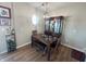 Well-lit dining area with hardwood floors and a stylish hutch at 15365 Mystic Rock Dr, Carmel, IN 46033
