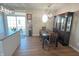 Bright dining room features hardwood floors, a charming window, and a built-in hutch at 15365 Mystic Rock Dr, Carmel, IN 46033