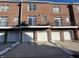 Brick townhouses with attached garages and balconies at 15365 Mystic Rock Dr, Carmel, IN 46033