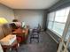 Spacious home office with large window, hardwood floors, and built-in desk at 15365 Mystic Rock Dr, Carmel, IN 46033