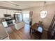 Modern kitchen with white cabinets, island, and stainless steel appliances at 15365 Mystic Rock Dr, Carmel, IN 46033