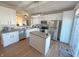 Modern kitchen with white cabinets, island, and stainless steel appliances at 15365 Mystic Rock Dr, Carmel, IN 46033