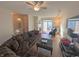 Spacious living room with hardwood floors, a fireplace, and sectional sofa at 15365 Mystic Rock Dr, Carmel, IN 46033