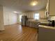 Modern kitchen with stainless steel appliances and light grey cabinets at 1608 Edgecombe Ave, Indianapolis, IN 46227