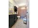 Bathroom with shower/tub combo and dark vanity at 1683 W State Road 42, Mooresville, IN 46158