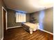 Bedroom with hardwood floors and window coverings at 1683 W State Road 42, Mooresville, IN 46158