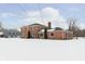 Brick house with a spacious backyard in winter at 1716 Westwood Dr, Anderson, IN 46011