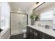 Modern bathroom with marble shower and a stylish vanity at 1716 Westwood Dr, Anderson, IN 46011