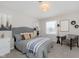 Spacious bedroom with a cozy sitting area and neutral decor at 1716 Westwood Dr, Anderson, IN 46011