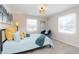 Spacious bedroom with a comfy bed and window seat at 1716 Westwood Dr, Anderson, IN 46011