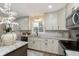Updated kitchen features stainless steel appliances and granite countertops at 1716 Westwood Dr, Anderson, IN 46011