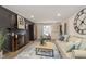 Spacious living room with fireplace and large clock at 1716 Westwood Dr, Anderson, IN 46011